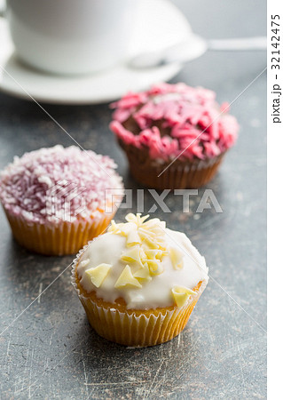 Tasty sweet cupcakes. 32142475