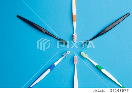 Multi-colored toothbrushes arranged in circle Multi-colored toothbrushes arranged in circle 32143677