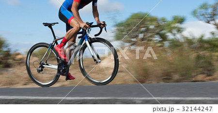 Motion blur of a bike race with the bicycle  32144247