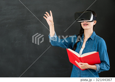 asian woman student touch screen with VR headset asian woman student touch screen with VR headset 32144367