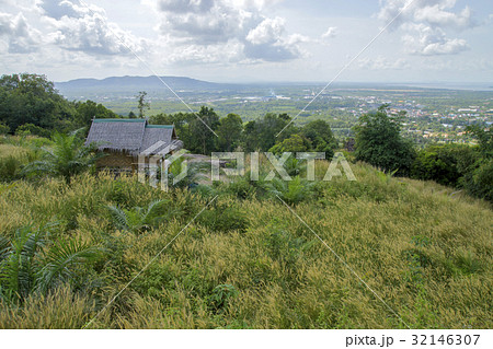Hut on the hillside with flower grass. 32146307