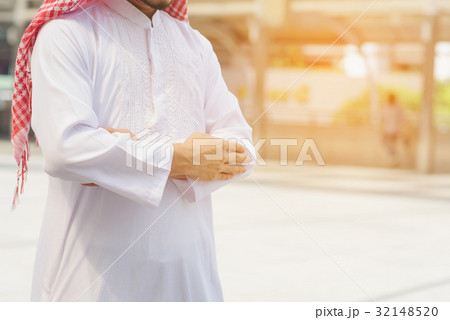 Muslim man wearing white traditional cloth 32148520