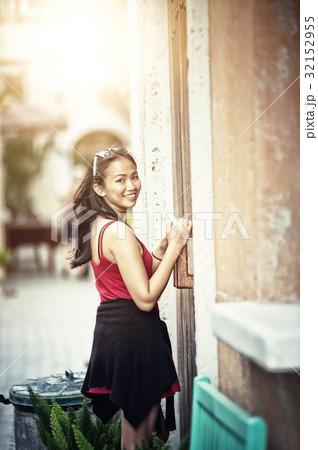 Asian summer woman leaning against door 32152955