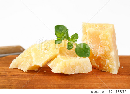 Parmesan cheese on cutting board 32153352