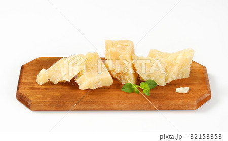 Parmesan cheese on cutting board 32153353