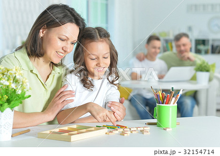 Mother and daughter playing  32154714