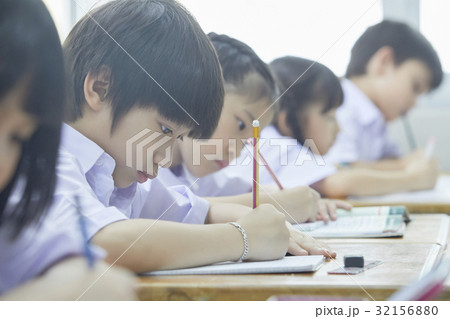 students are doing their exercise with concentration in class students are doing their exercise with concentration in class 32156880