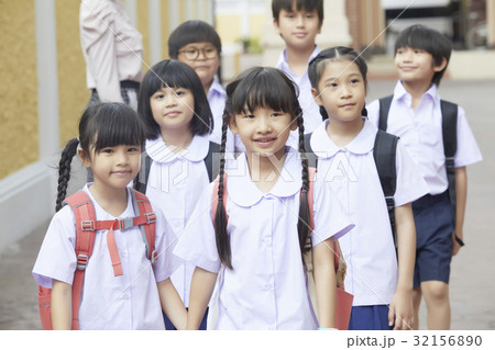 students are walking and smiling together students are walking and smiling together 32156890