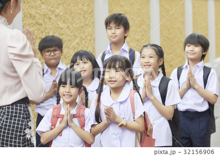 Schoolchildren are greeting teacher in Thai style Schoolchildren are greeting teacher in Thai style 32156906