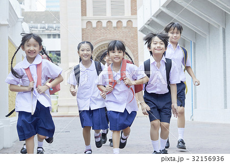 Students are running happily to school Students are running happily to school 32156936