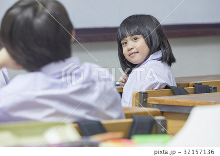 a picture of the girl looking and smiling at the boy in the class 32157136