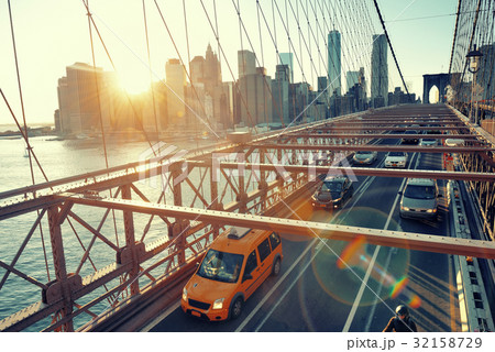Brooklyn Bridge with traffic at sunset 32158729
