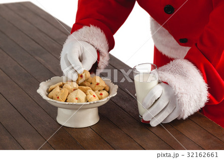 Close-up of santa claus taking cookies 32162661