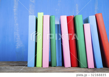 Stack of books on a blue background. Stack of books on a blue background. 32168835