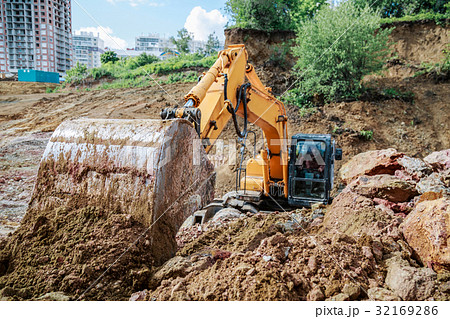 Excavator performs excavation work Excavator performs excavation work 32169286