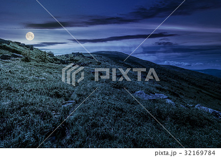 grassy hillside of mountain in summer at night grassy hillside of mountain in summer at night 32169784