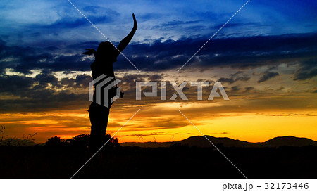 silhouette of woman and beautiful twilight with sunset silhouette of woman and beautiful twilight with sunset 32173446