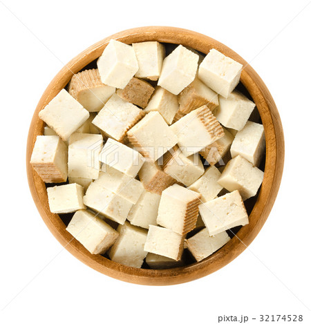 Smoked tofu cubes in wooden bowl Smoked tofu cubes in wooden bowl 32174528