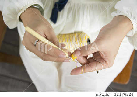 Close-up of hands knitting.  32176223