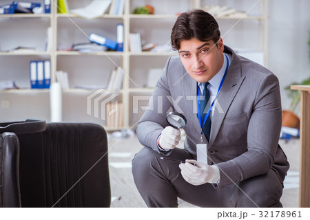 Young man during crime investigation in office Young man during crime investigation in office 32178961