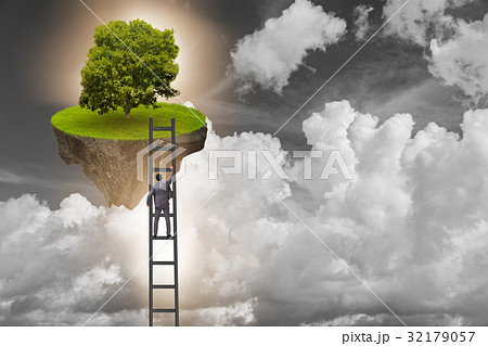 Businessman climbing to floating island Businessman climbing to floating island 32179057