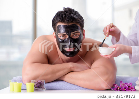 Handsome man in spa massage concept Handsome man in spa massage concept 32179172