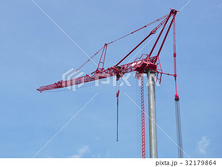 red construction crane on blue sky 32179864