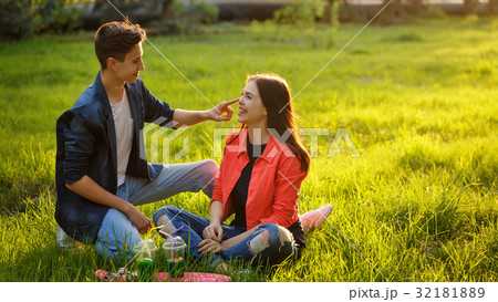 Loving couple of teenagers. Picnic Loving couple of teenagers. Picnic 32181889