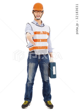 Male worker holding tool box and handshake pose Male worker holding tool box and handshake pose 32183631