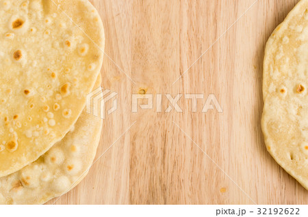 Flat Bread on a Wooden Background Flat Bread on a Wooden Background 32192622