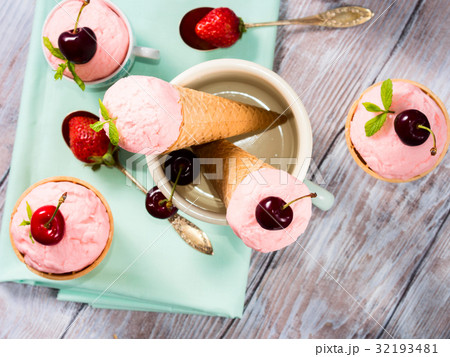Home made strawberry ice cream served in cones 32193481