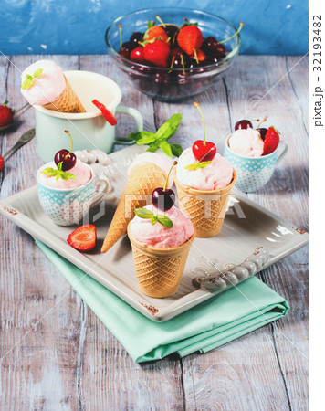 Home made strawberry ice cream served in cones 32193482