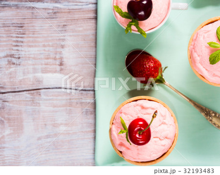 Home made strawberry ice cream served in cones Home made strawberry ice cream served in cones 32193483