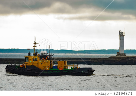 Small orange tug ship 32194371
