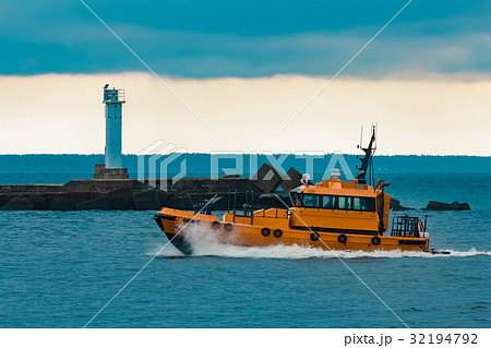 Orange pilot ship moving at speed 32194792