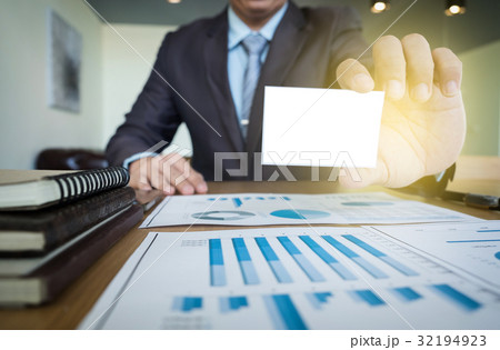 Close-up of man hands holding card, working on 32194923