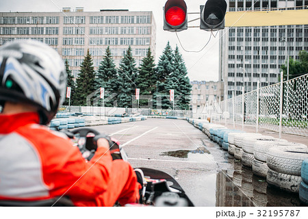Go kart driver on start line, back view 32195787