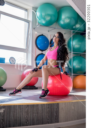 Fitness. Cute woman posing during workout at gym Fitness. Cute woman posing during workout at gym 32200301
