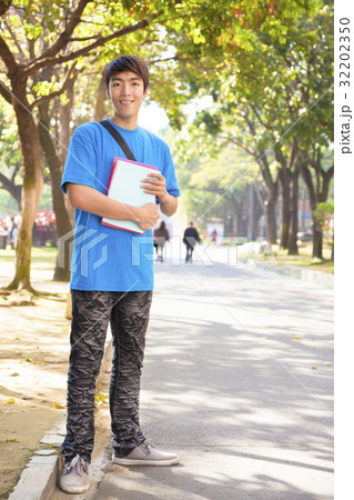 young student standing at campus young student standing at campus 32202350