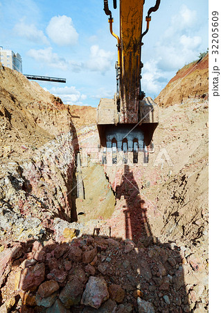 Excavator digging a trench for the pipeline.  32205609
