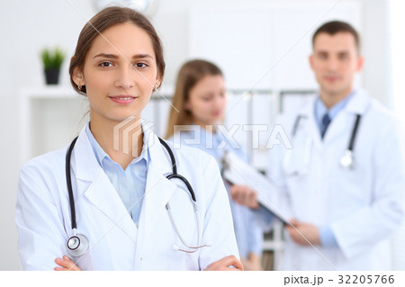 Young beautiful female doctor smiling  on th 32205766