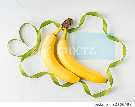 Two bananas with green ribbon frame Two bananas with green ribbon frame 32206498