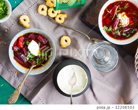 Beetroot soup served in bowls on napkin 32206503