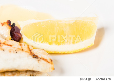 Delicious baked dorado fillet with lemon. 32208370