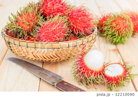 fresh tropical rambutan fruits over basket fresh tropical rambutan fruits over basket 32210090