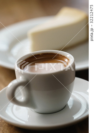 fresh espresso and cheesecake on table 32212475