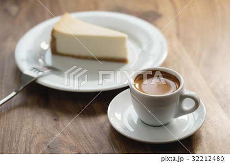 fresh espresso and cheesecake on table fresh espresso and cheesecake on table 32212480