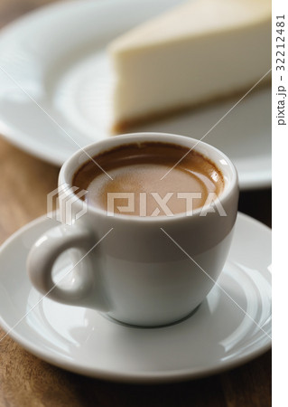 fresh espresso and cheesecake on table fresh espresso and cheesecake on table 32212481