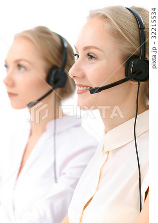 Call center. Focus on beautiful blonde woman in Call center. Focus on beautiful blonde woman in 32215534