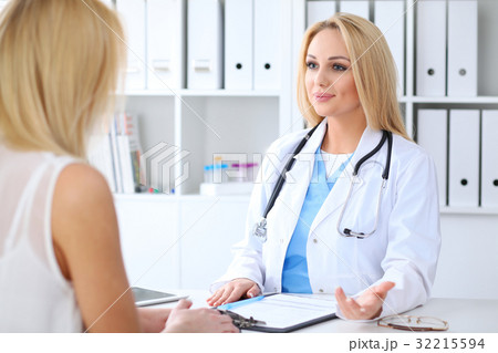 Doctor and  patient  discussing something whi 32215594
